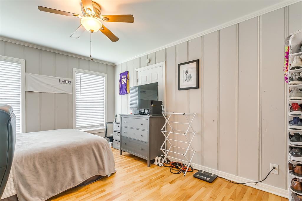 3567 Norfolk Road Fort Worth, TX 76109 - Photo 18 of 21 a bedroom with a bed and a chandelier