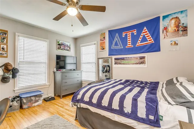 a bedroom with a bed and a chandelier