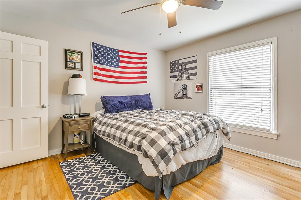 3567 Norfolk Road Fort Worth, TX 76109 - Photo 6 of 21 a bedroom with a bed and a chandelier