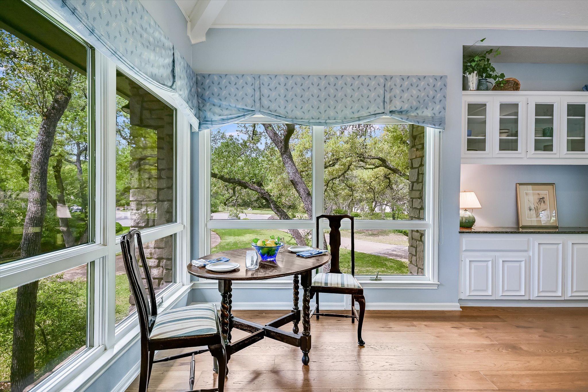 3901 Prentice Lane Austin, TX 78746 - Photo 11 of 40 Large windows provide beautiful views of the surrounding trees while preparing meals.