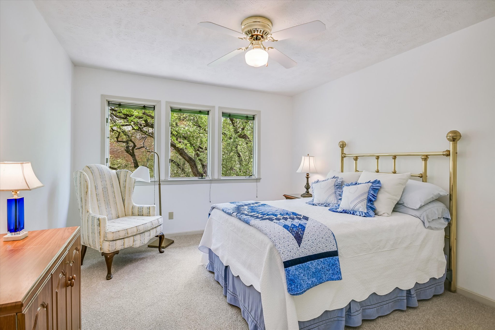 3901 Prentice Lane Austin, TX 78746 - Photo 19 of 40 Each bedroom provides a quiet retreat within the home’s serene, nature-filled setting.