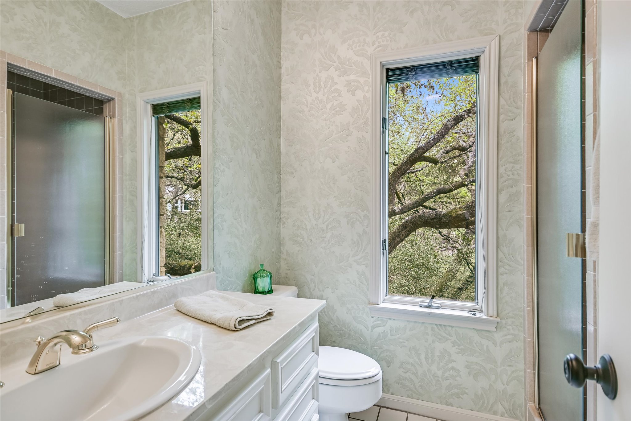 3901 Prentice Lane Austin, TX 78746 - Photo 21 of 40 The bathrooms are conveniently located near the guest bedrooms for easy access.