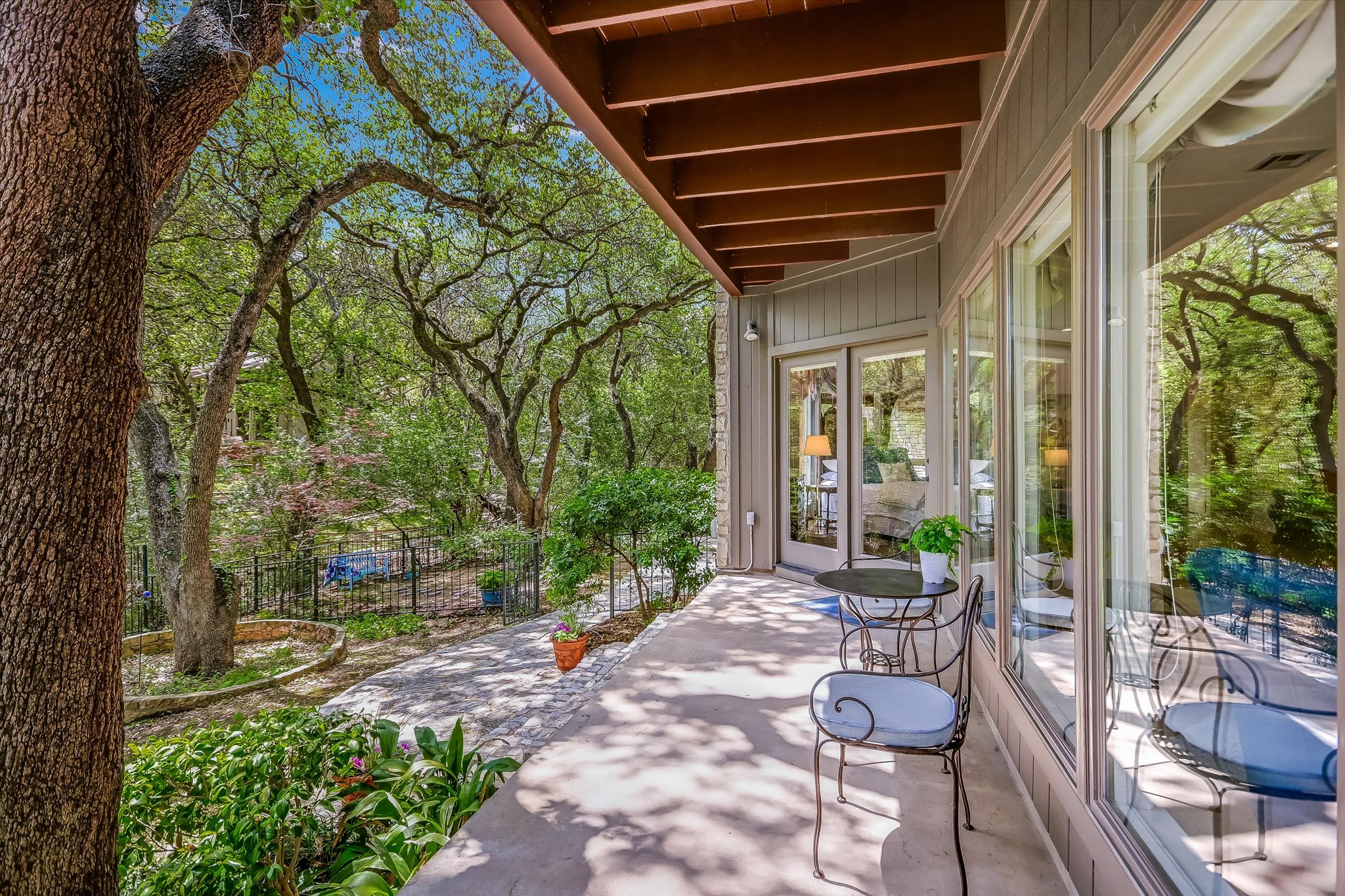 3901 Prentice Lane Austin, TX 78746 - Photo 26 of 40 Outdoor seating areas allow you to fully experience the property’s serene environment.
