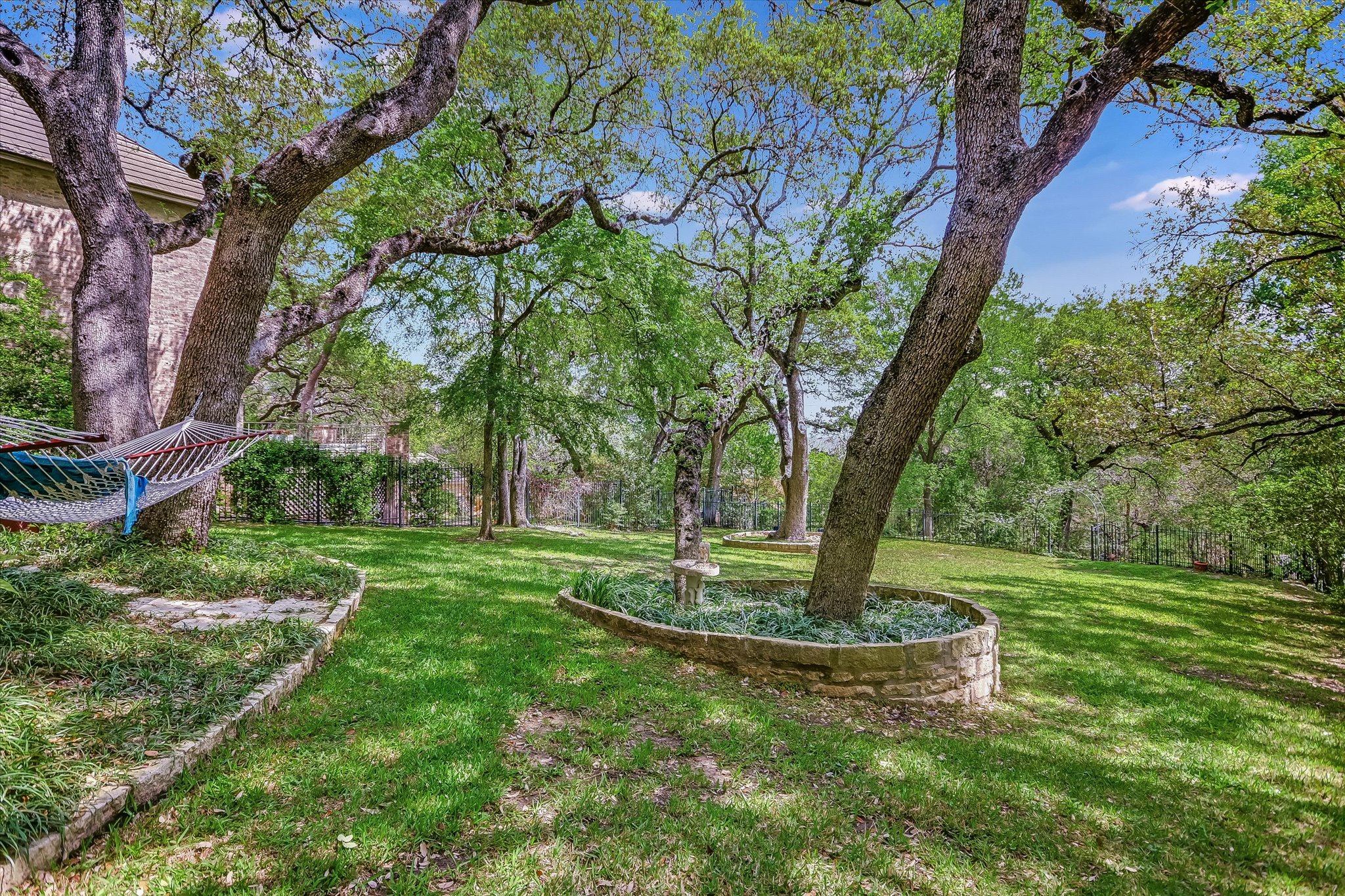3901 Prentice Lane Austin, TX 78746 - Photo 28 of 40 The backyard feels like a private sanctuary just minutes from the city.