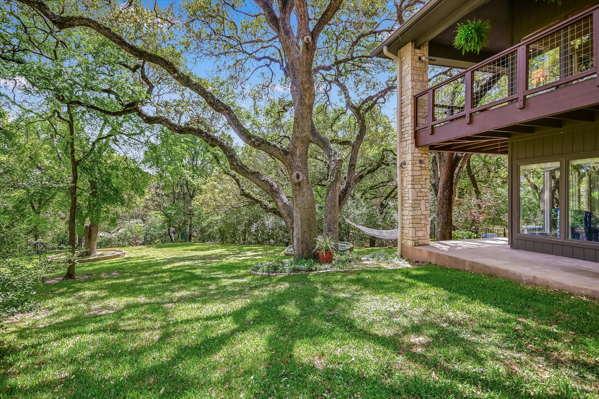 3901 Prentice Lane Austin, TX 78746 - Photo 29 of 40 The property’s wooded landscape offers a rare combination of beauty, privacy, and space.