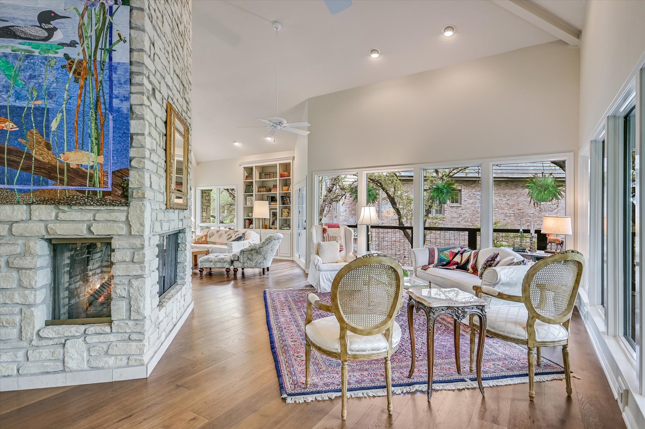 3901 Prentice Lane Austin, TX 78746 - Photo 8 of 40 The living room is anchored by a beautiful central fireplace that serves as the heart of the home.