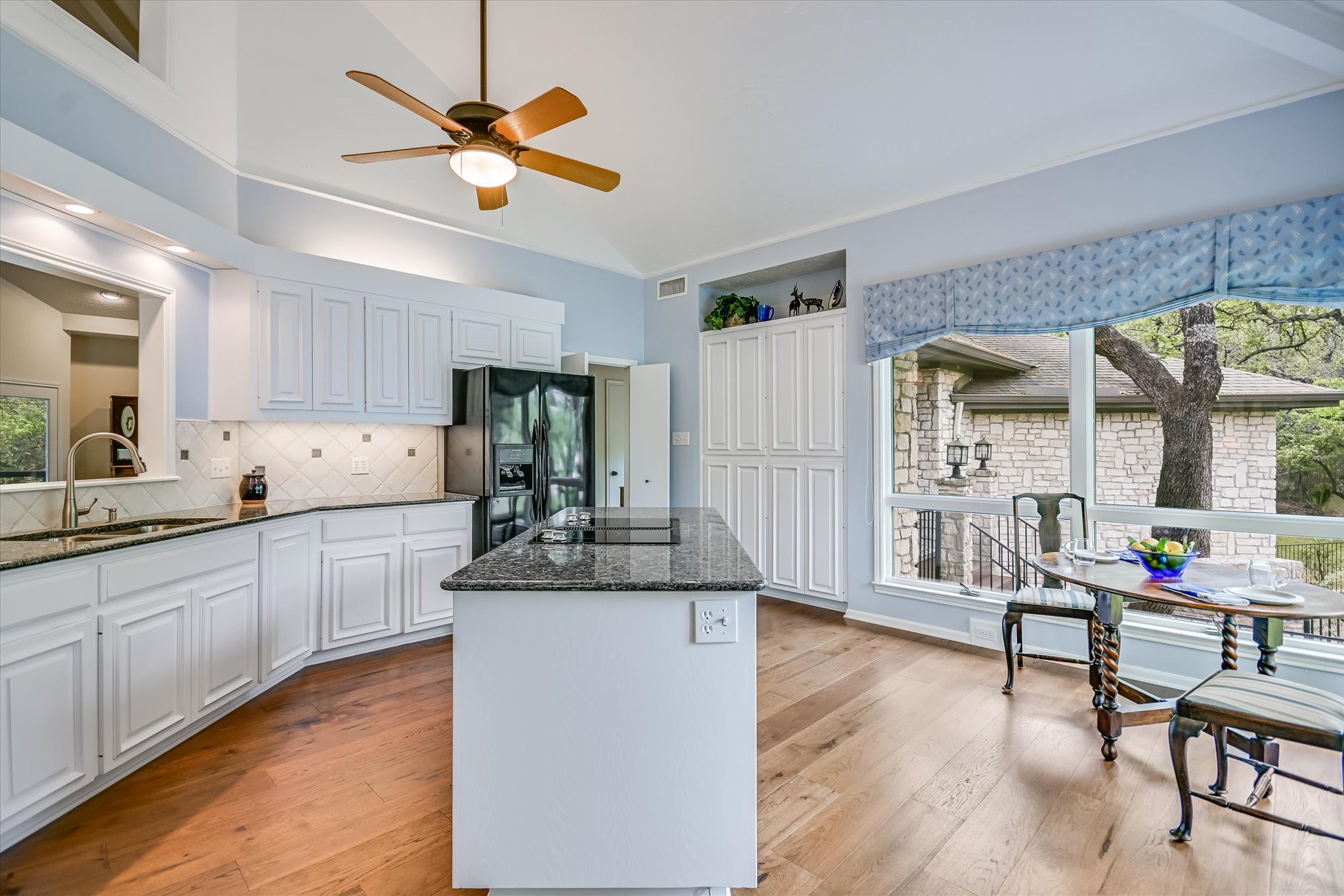 3901 Prentice Lane Austin, TX 78746 - Photo 10 of 40 Ample cabinetry and workspace create a highly functional cooking environment.