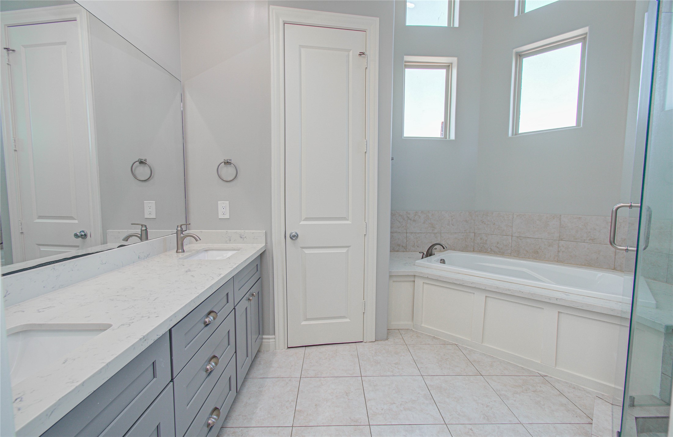 8903 Spring Knoll Forest Drive Houston, TX 77080 - Photo 12 of 29 a bathroom with a granite countertop sink a toilet and bathtub