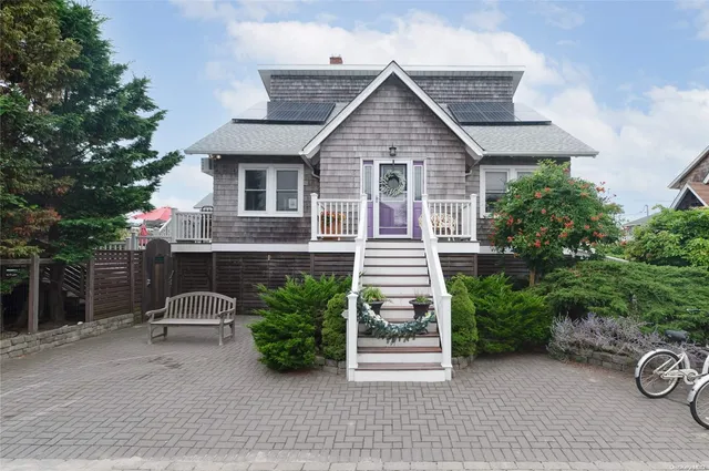 a view of a house with garden and plants