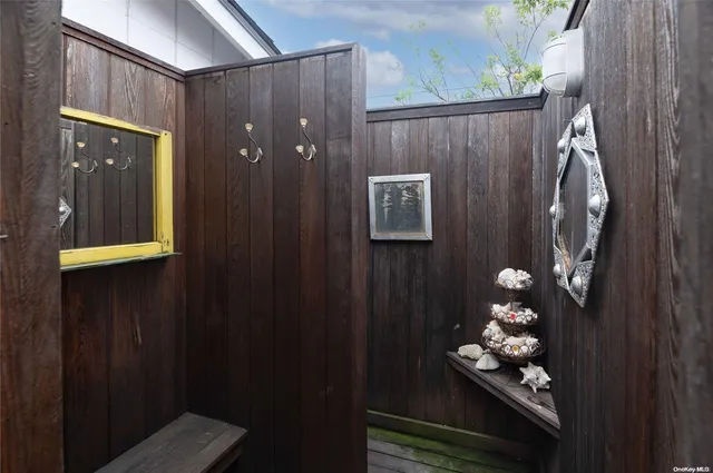 a bathroom with a sink mirror and vanity