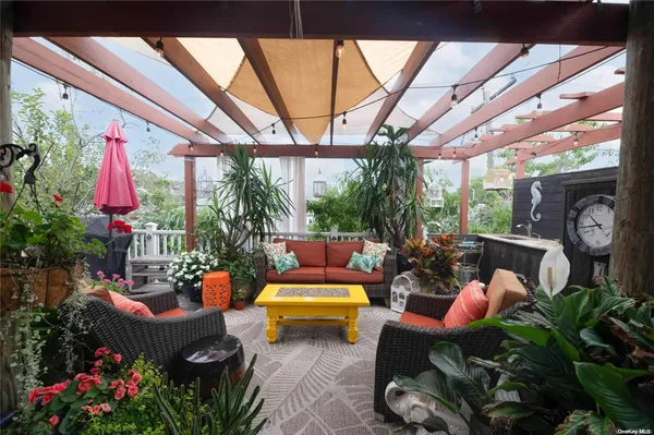 a outdoor living space with furniture and garden view