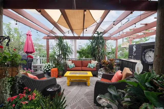 a outdoor living space with furniture and garden view