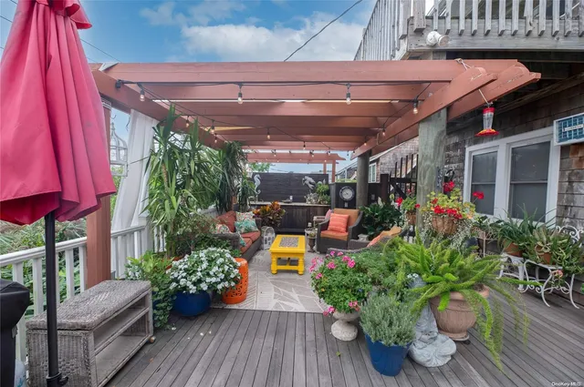 a view of a chairs and table in a patio