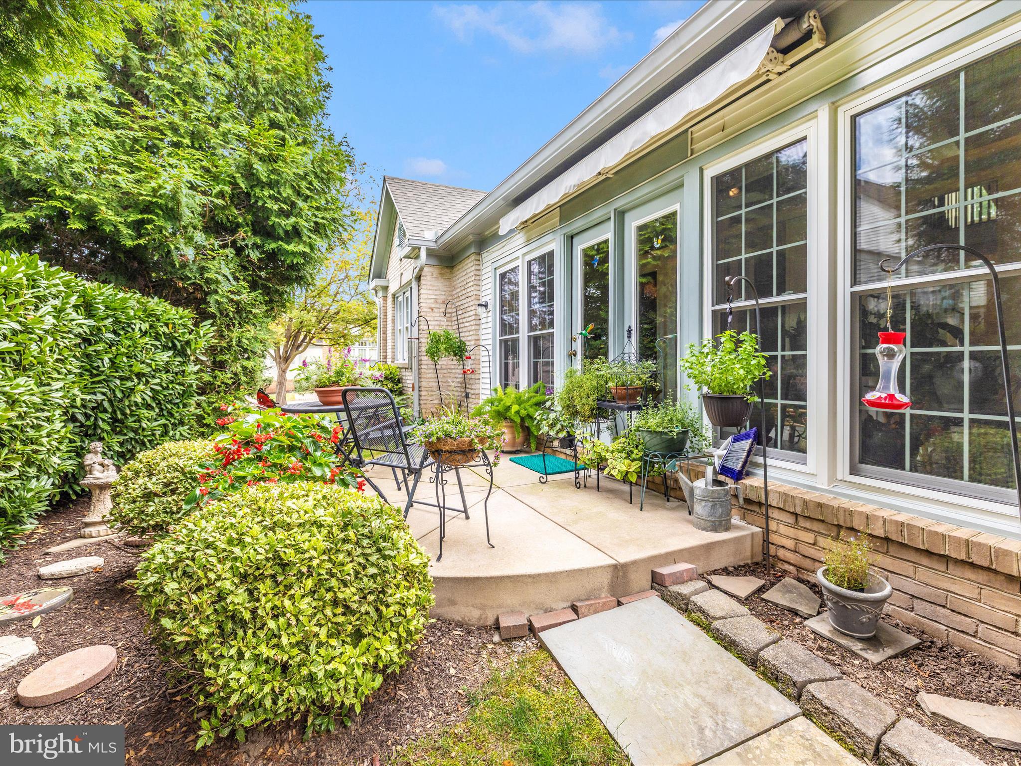 2462 Bear Den Road Frederick, MD 21701 - Photo 9 of 61 a view of a patio with table and chairs and potted plants