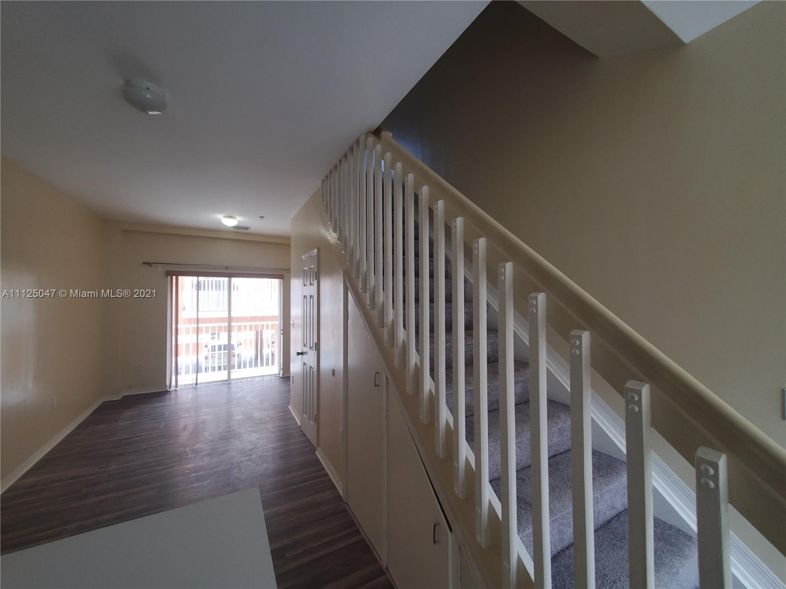 928 Southwest 3rd Street, Unit 203 Miami, FL 33130 - Photo 12 of 16 a view of entryway and hall with wooden floor