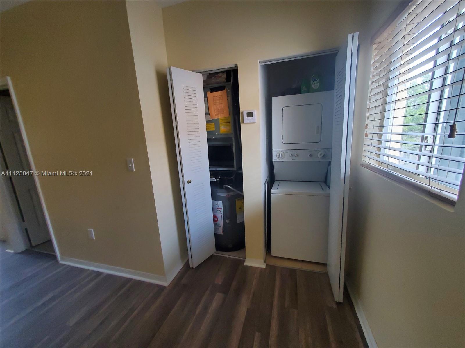 928 Southwest 3rd Street, Unit 203 Miami, FL 33130 - Photo 13 of 16 wooden floor in a gallery