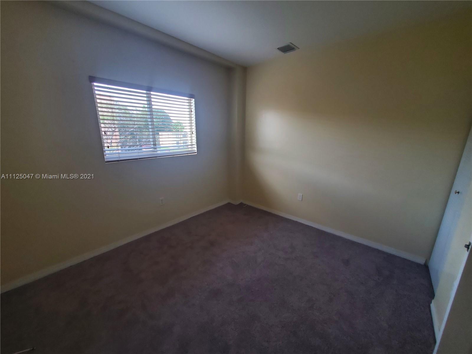 928 Southwest 3rd Street, Unit 203 Miami, FL 33130 - Photo 15 of 16 an empty room with a window