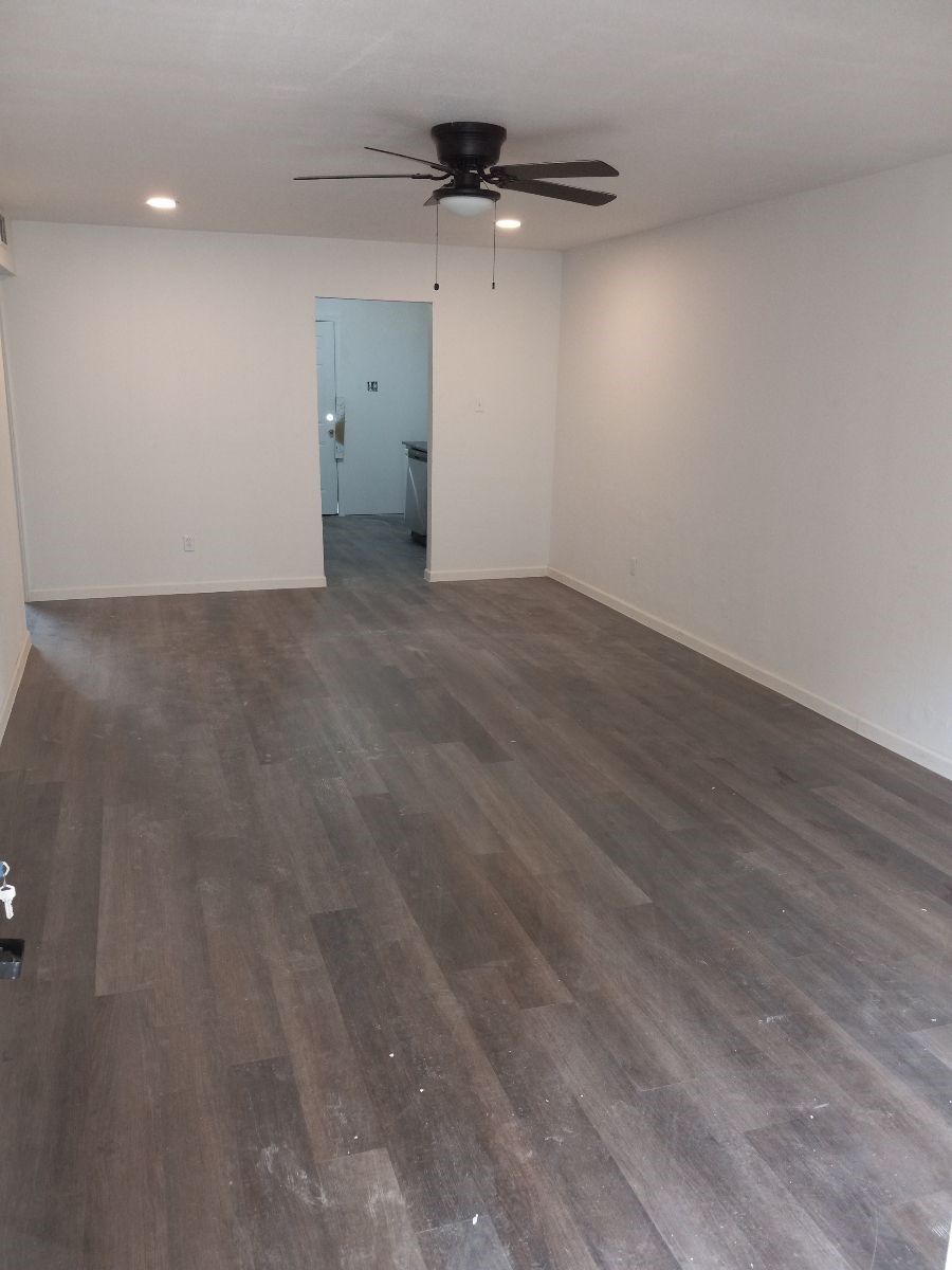 2681 Gessner Road, Unit 402 Houston, TX 77080 - Photo 4 of 11 a view of a room with wooden floor