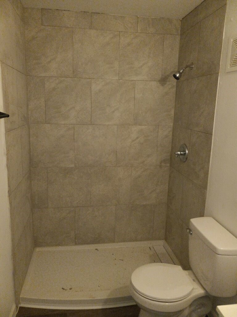 2681 Gessner Road, Unit 402 Houston, TX 77080 - Photo 8 of 11 a bathroom with a toilet and a shower