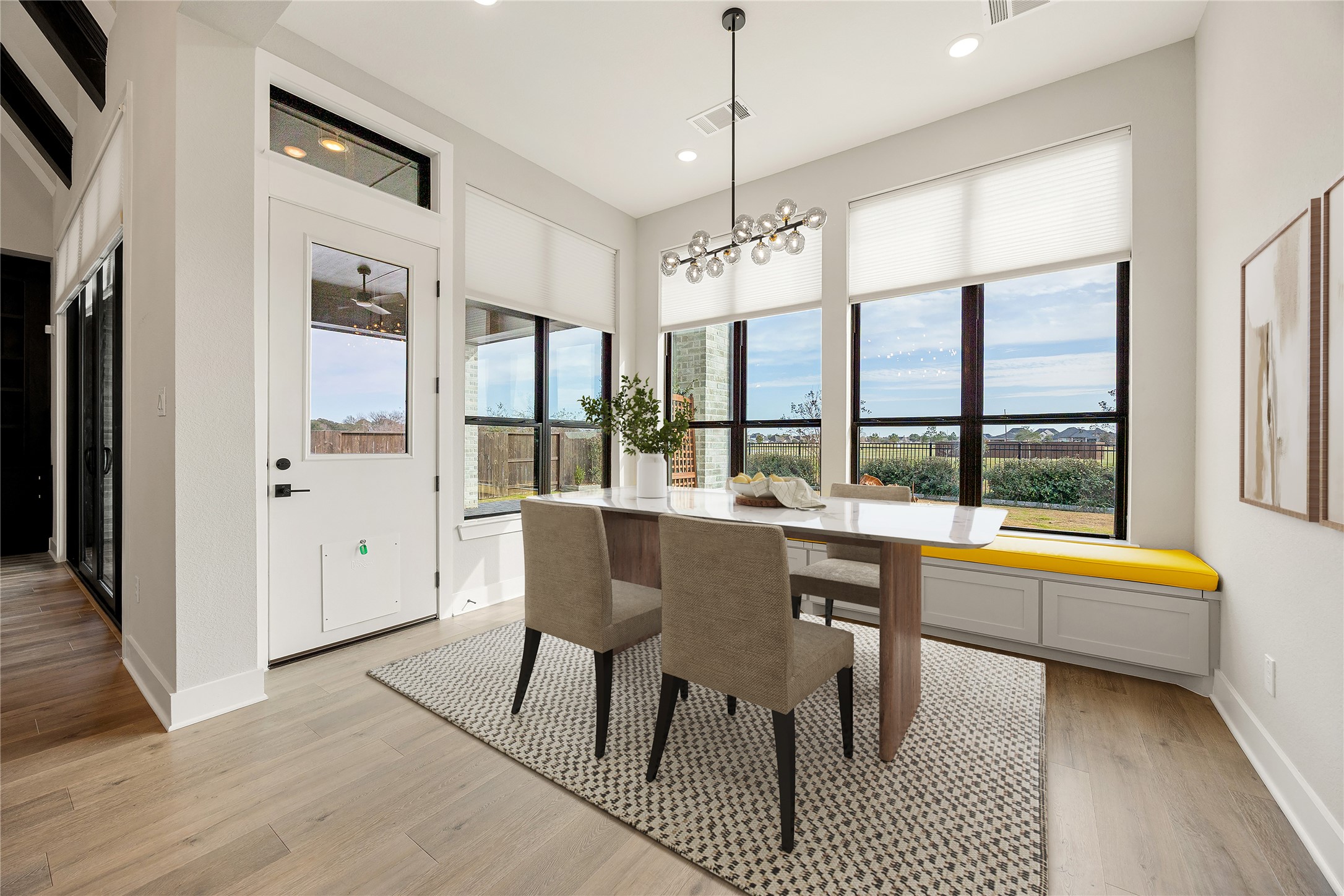 6707 Nimitz Court Katy, TX 77493 - Photo 13 of 43 a dining room with stainless steel appliances granite countertop a dining table chairs and chandelier