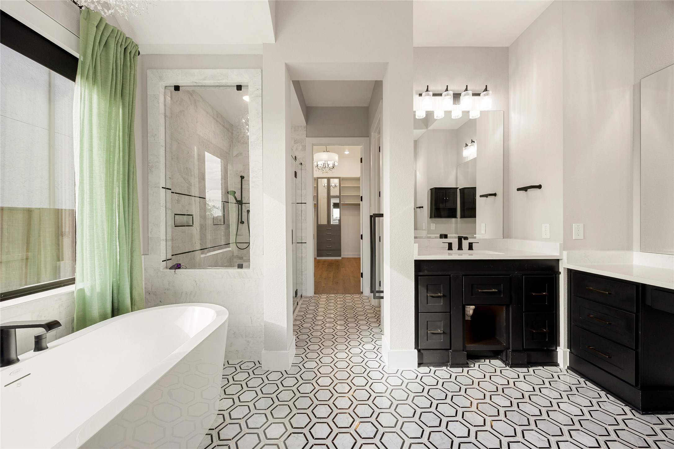 6707 Nimitz Court Katy, TX 77493 - Photo 18 of 43 a spacious bathroom with a double vanity sink a mirror and a bathtub