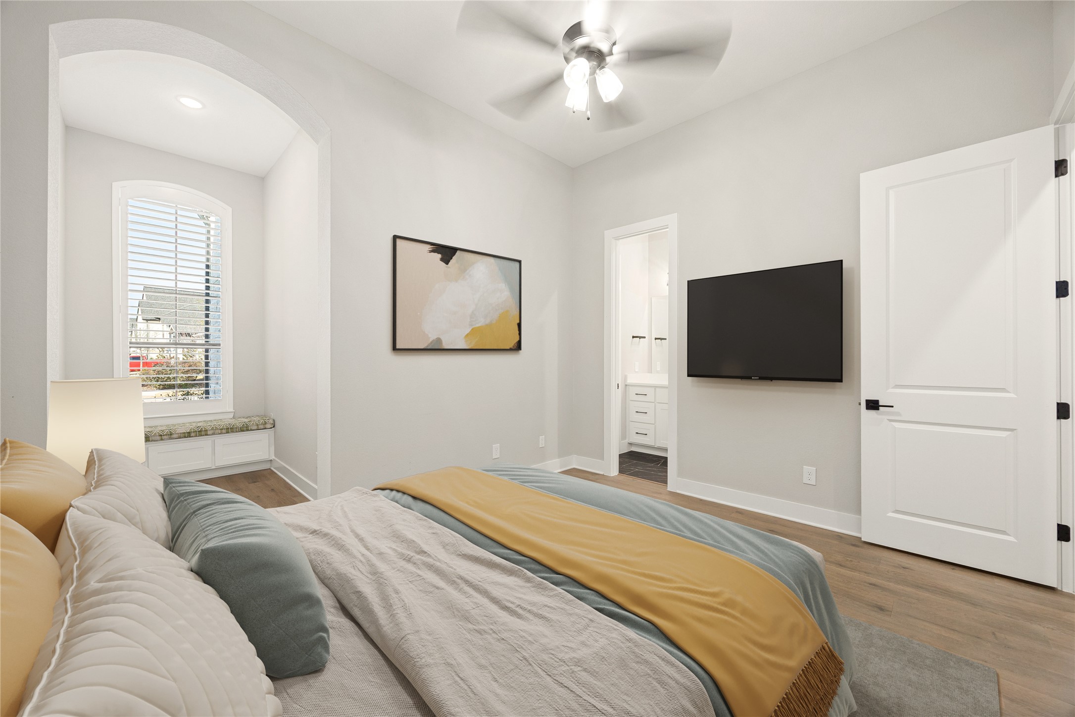 6707 Nimitz Court Katy, TX 77493 - Photo 25 of 43 a bedroom with a large bed and a flat screen tv