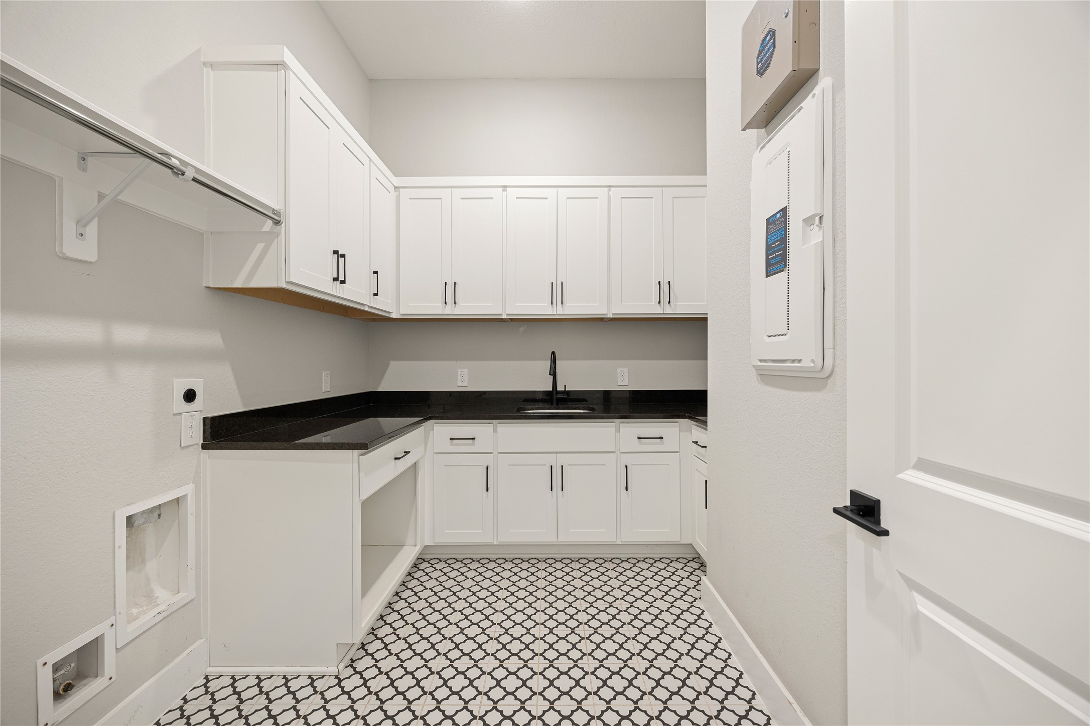 6707 Nimitz Court Katy, TX 77493 - Photo 27 of 43 a kitchen with white cabinets and white appliances