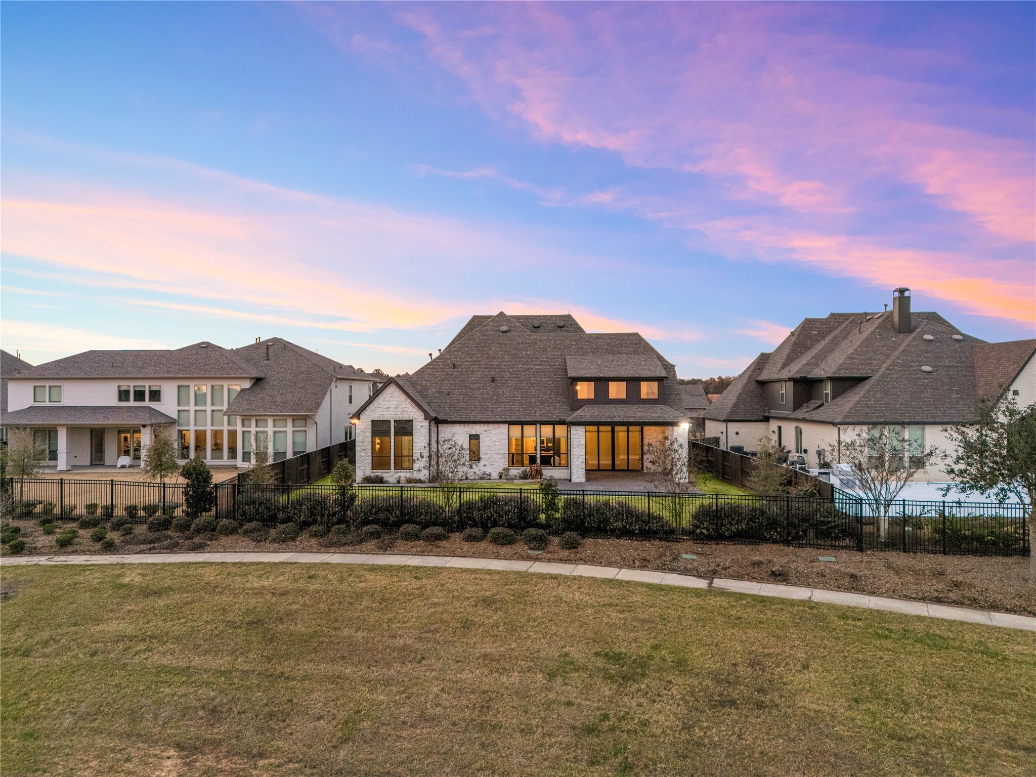 6707 Nimitz Court Katy, TX 77493 - Photo 33 of 43 a front view of a house with a yard and lake view
