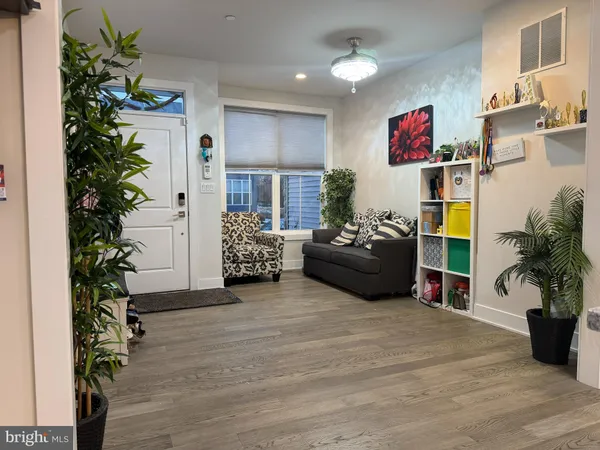 a living room with furniture plant and a potted plant