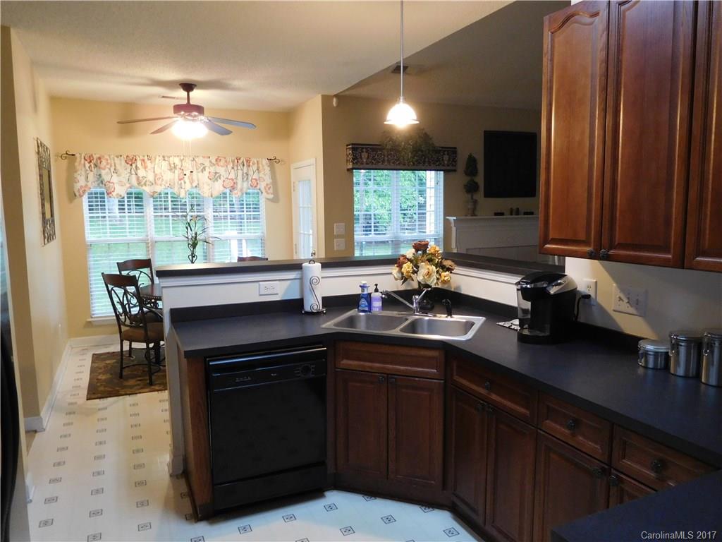 823 Knightsbridge Road Fort Mill, SC 29708 - Photo 2 of 24 a kitchen with a sink cabinets and window