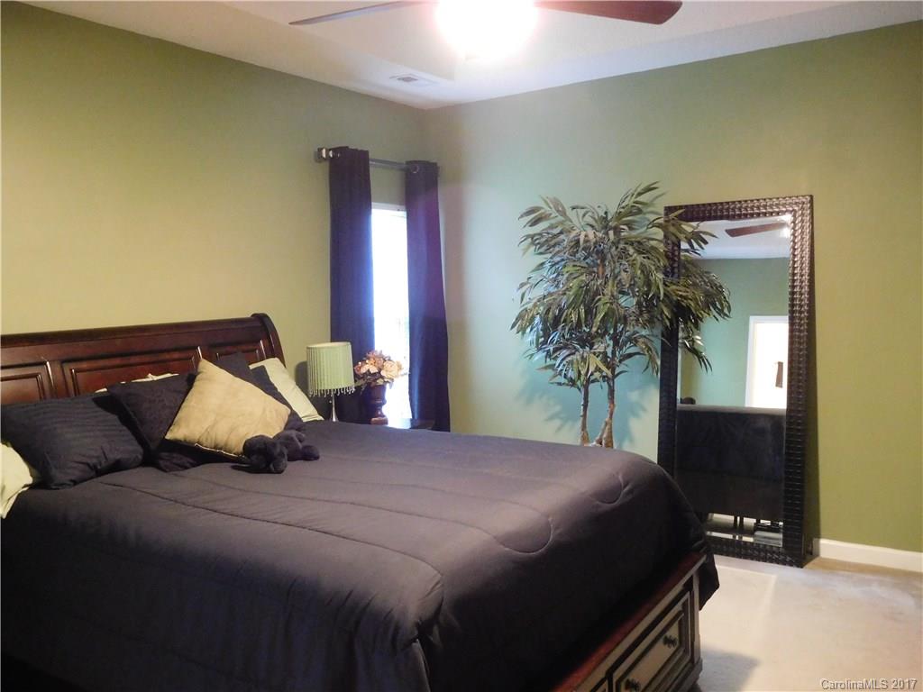 823 Knightsbridge Road Fort Mill, SC 29708 - Photo 12 of 24 a bedroom with a bed and a potted plant