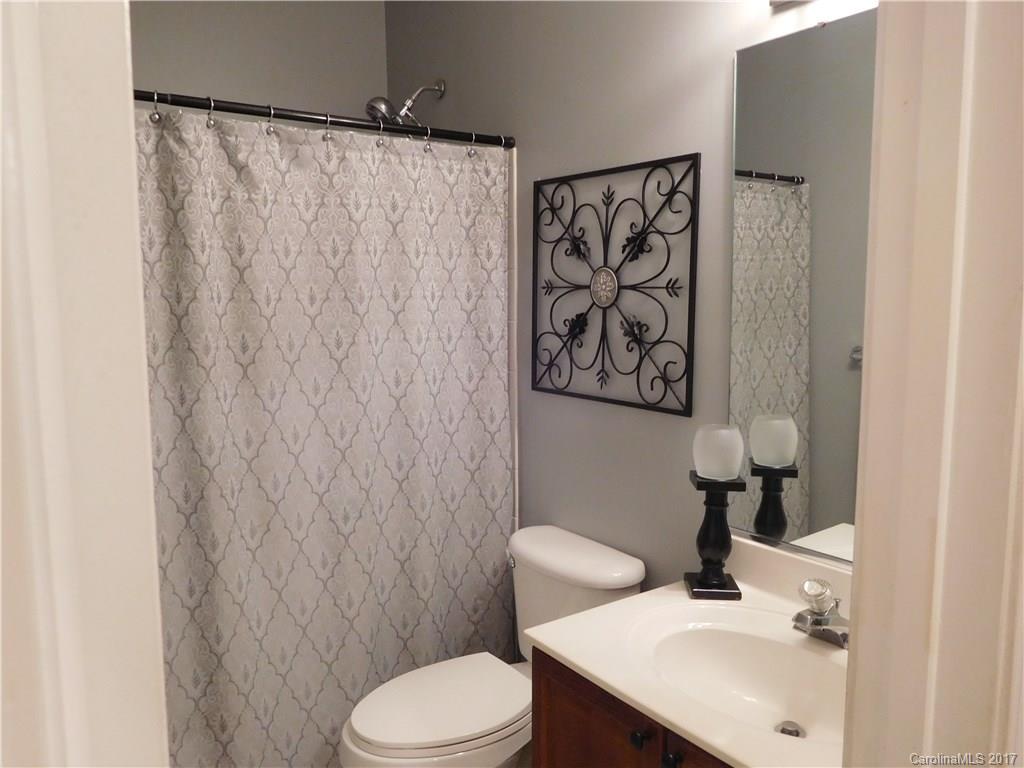 823 Knightsbridge Road Fort Mill, SC 29708 - Photo 19 of 24 a bathroom with a sink mirror and toilet