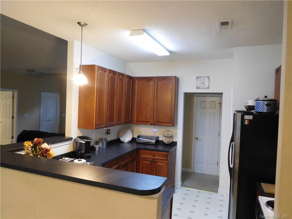 823 Knightsbridge Road Fort Mill, SC 29708 - Photo 3 of 24 a kitchen with stainless steel appliances granite countertop a refrigerator a sink and a stove