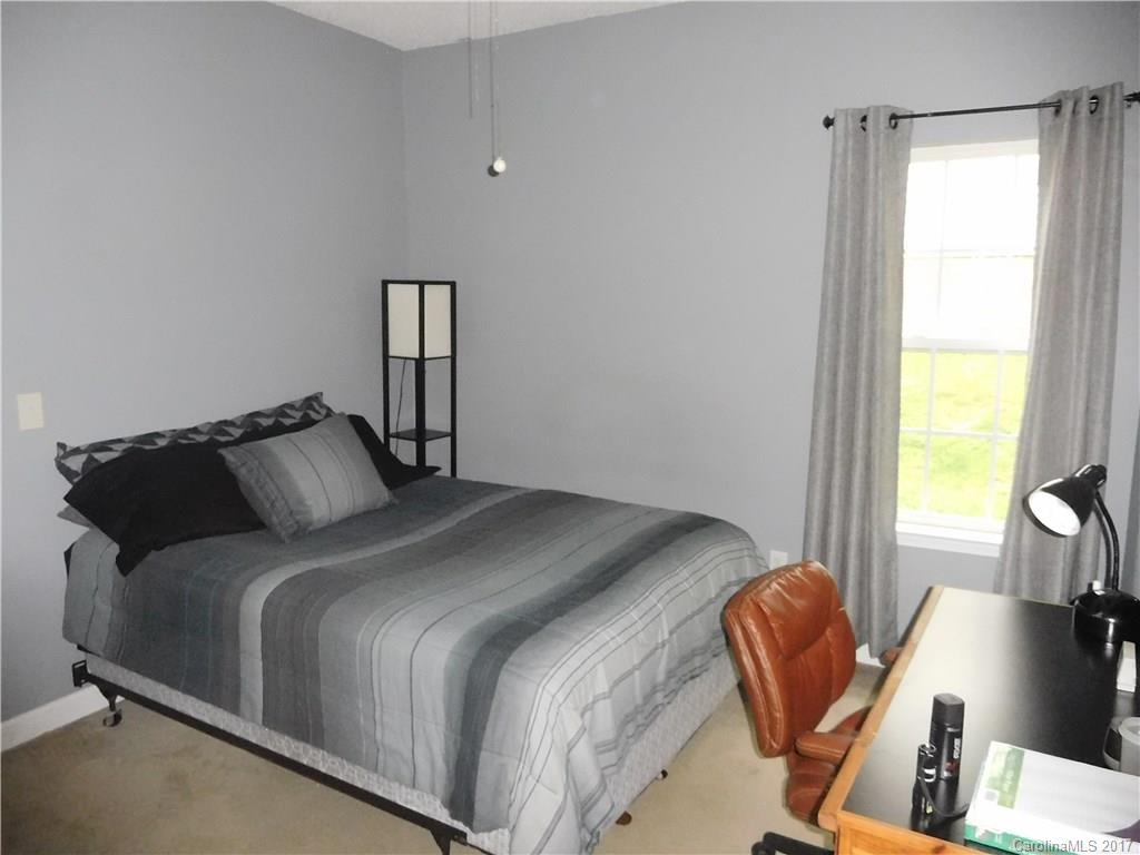 823 Knightsbridge Road Fort Mill, SC 29708 - Photo 22 of 24 a bedroom with bed and wooden floor
