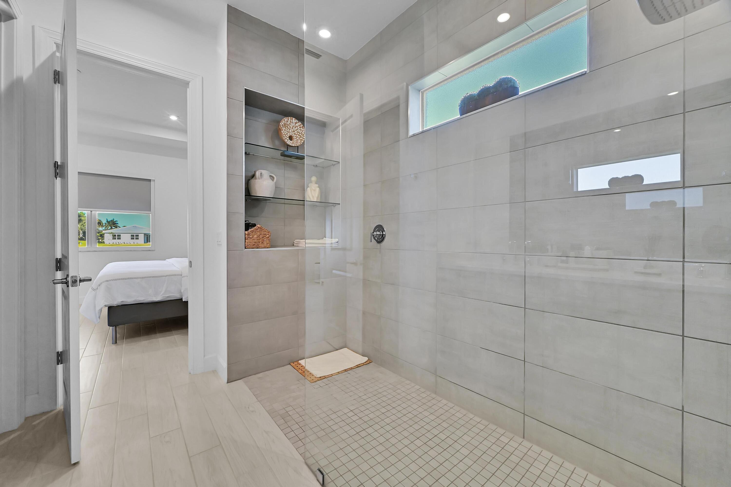 14185 Southwest Daphne St Port Port St. Lucie, FL 34987 - Photo 17 of 46 a bathroom with a sink and a shower