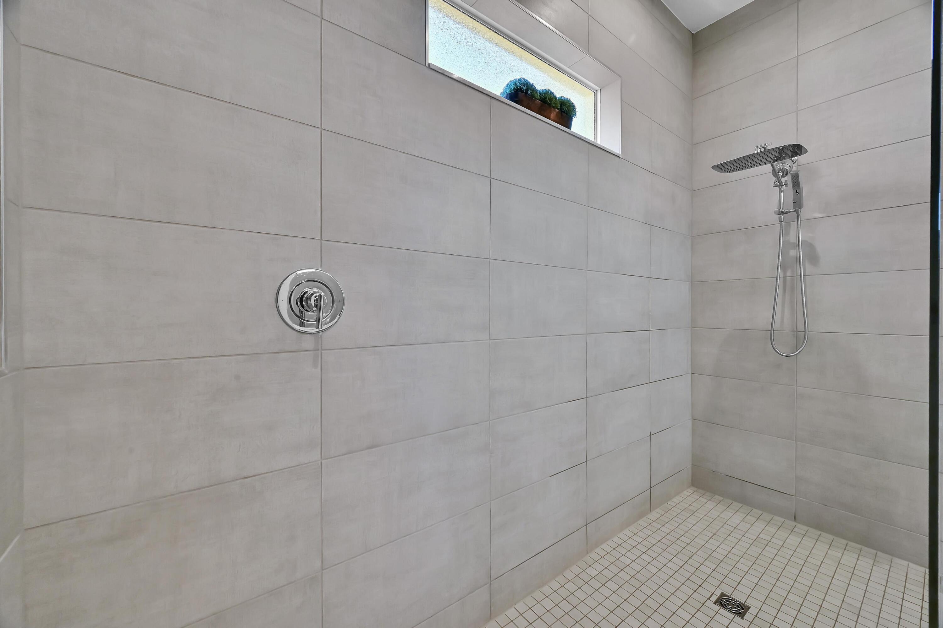 14185 Southwest Daphne St Port Port St. Lucie, FL 34987 - Photo 18 of 46 a bathroom with a shower