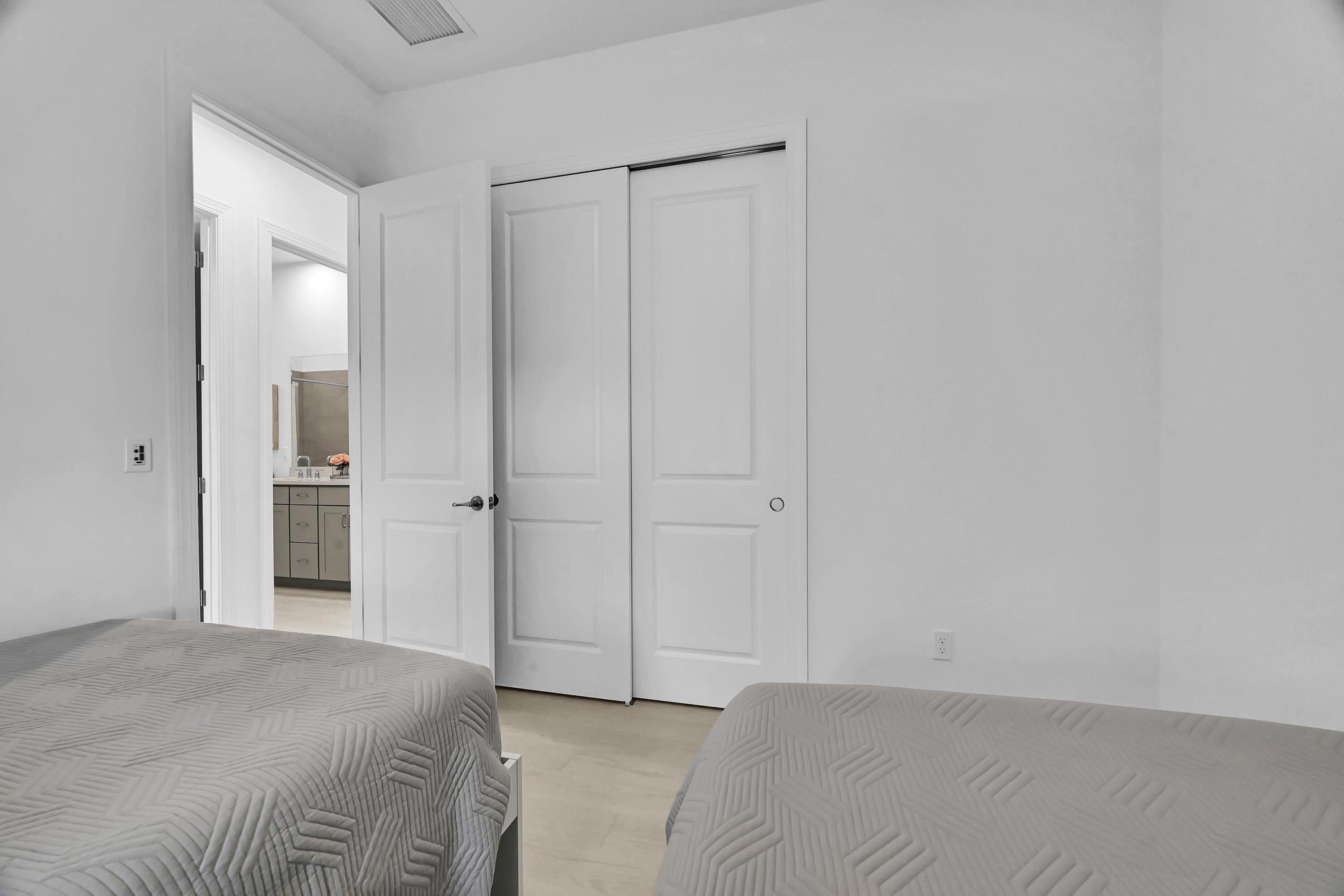 14185 Southwest Daphne St Port Port St. Lucie, FL 34987 - Photo 24 of 46 a view of a bedroom with closet area