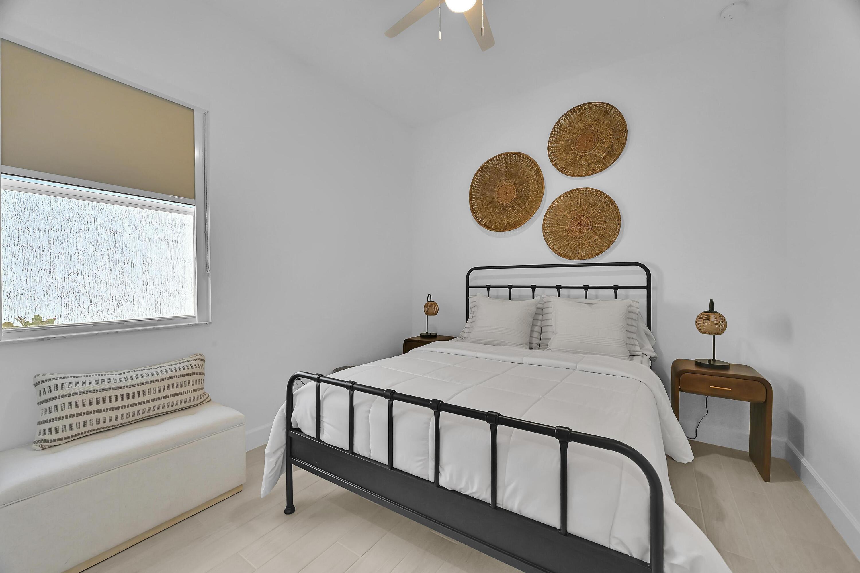 14185 Southwest Daphne St Port Port St. Lucie, FL 34987 - Photo 26 of 46 a bedroom with a bed and window