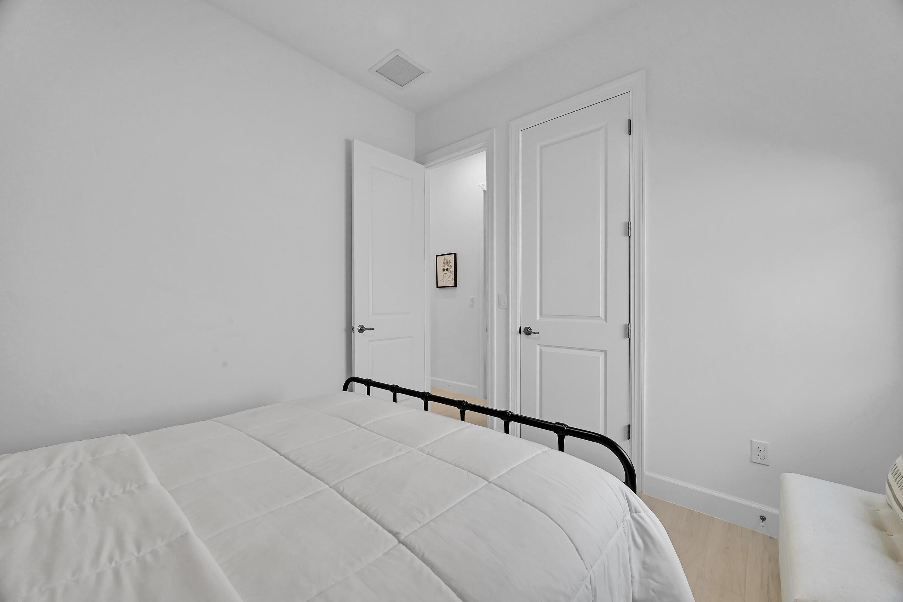 14185 Southwest Daphne St Port Port St. Lucie, FL 34987 - Photo 27 of 46 a view of a room with a bed