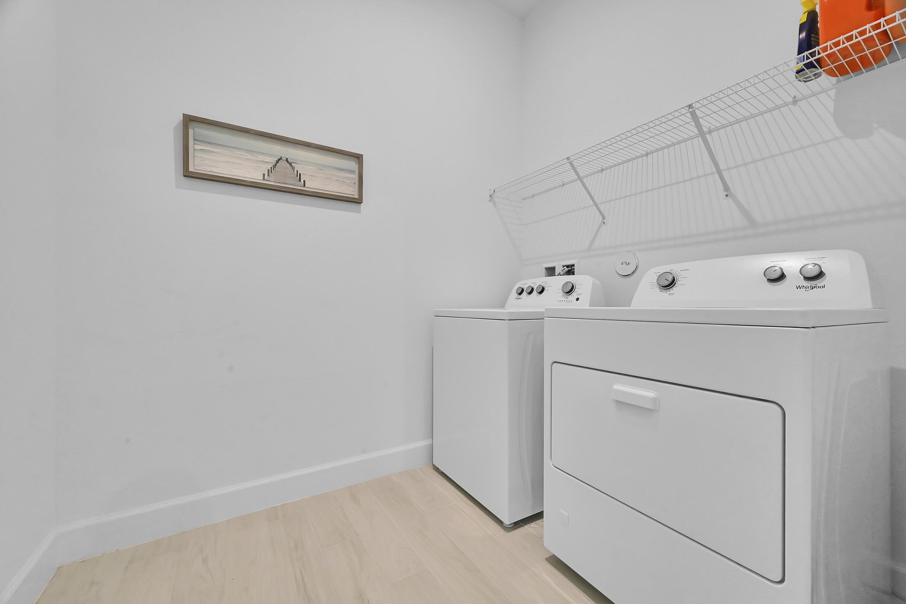 14185 Southwest Daphne St Port Port St. Lucie, FL 34987 - Photo 28 of 46 a utility room with dryer and washer