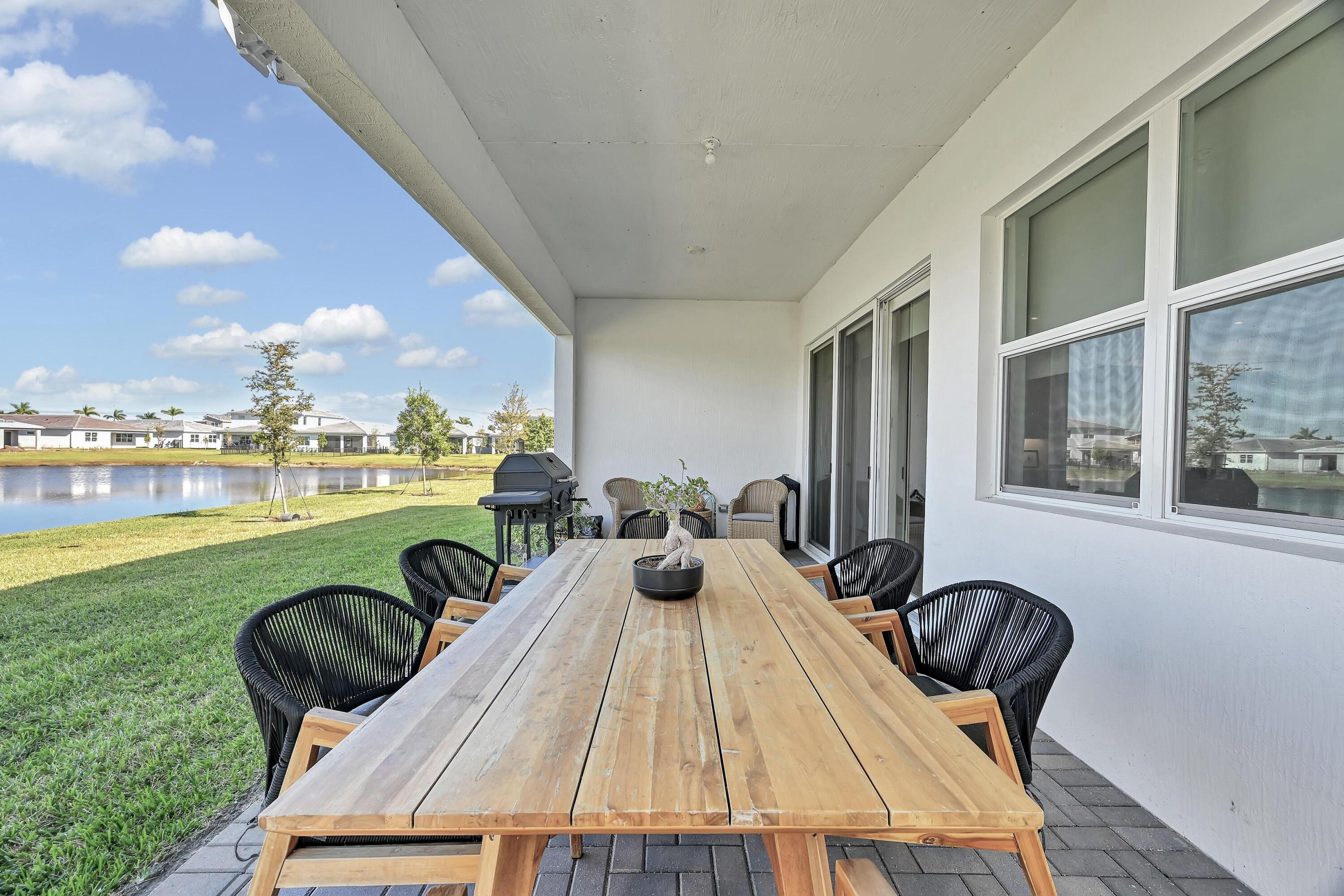 14185 Southwest Daphne St Port Port St. Lucie, FL 34987 - Photo 31 of 46 a view of a swimming pool and lounge chair