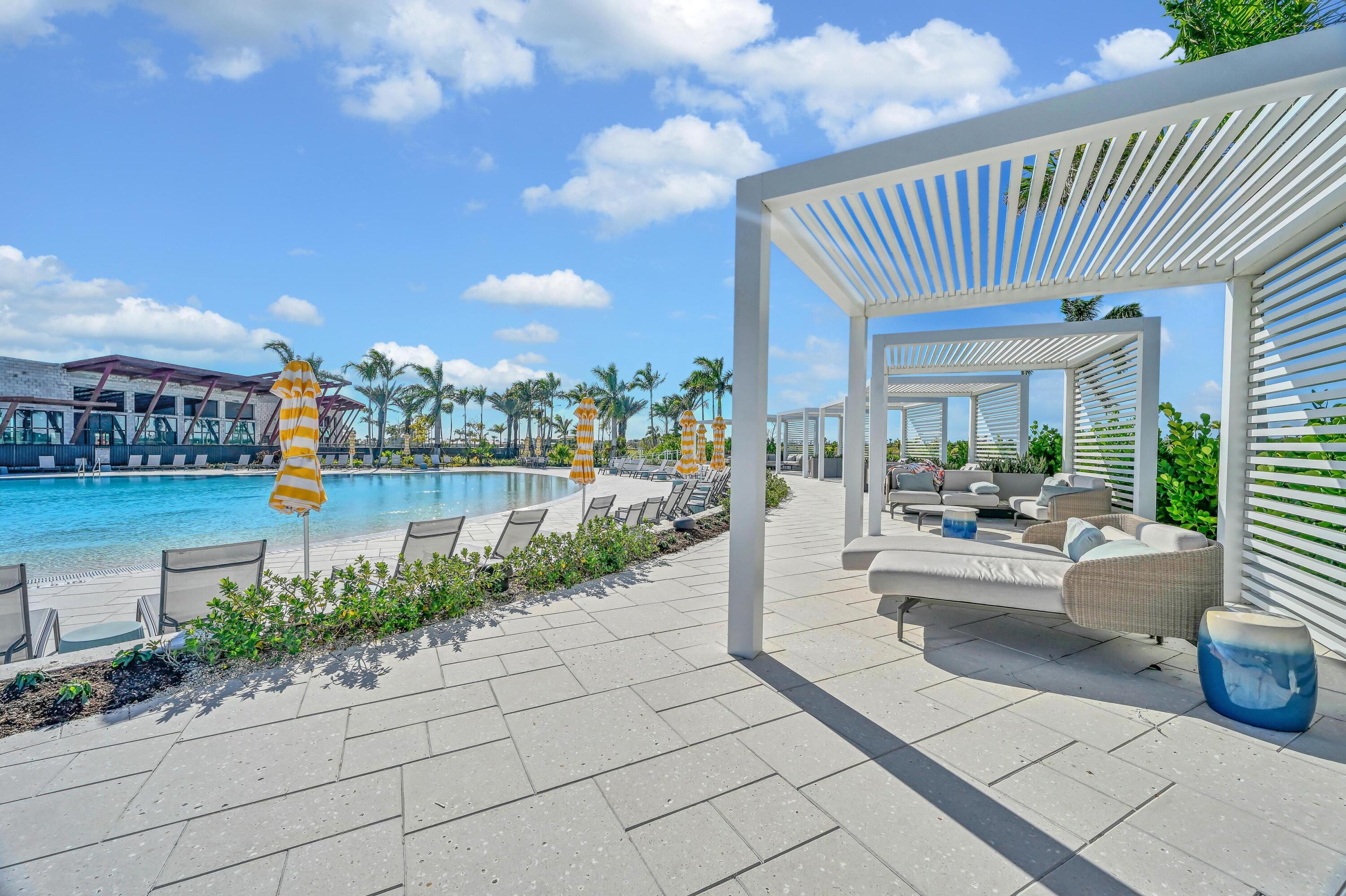 14185 Southwest Daphne St Port Port St. Lucie, FL 34987 - Photo 35 of 46 a view of a swimming pool and outdoor seating