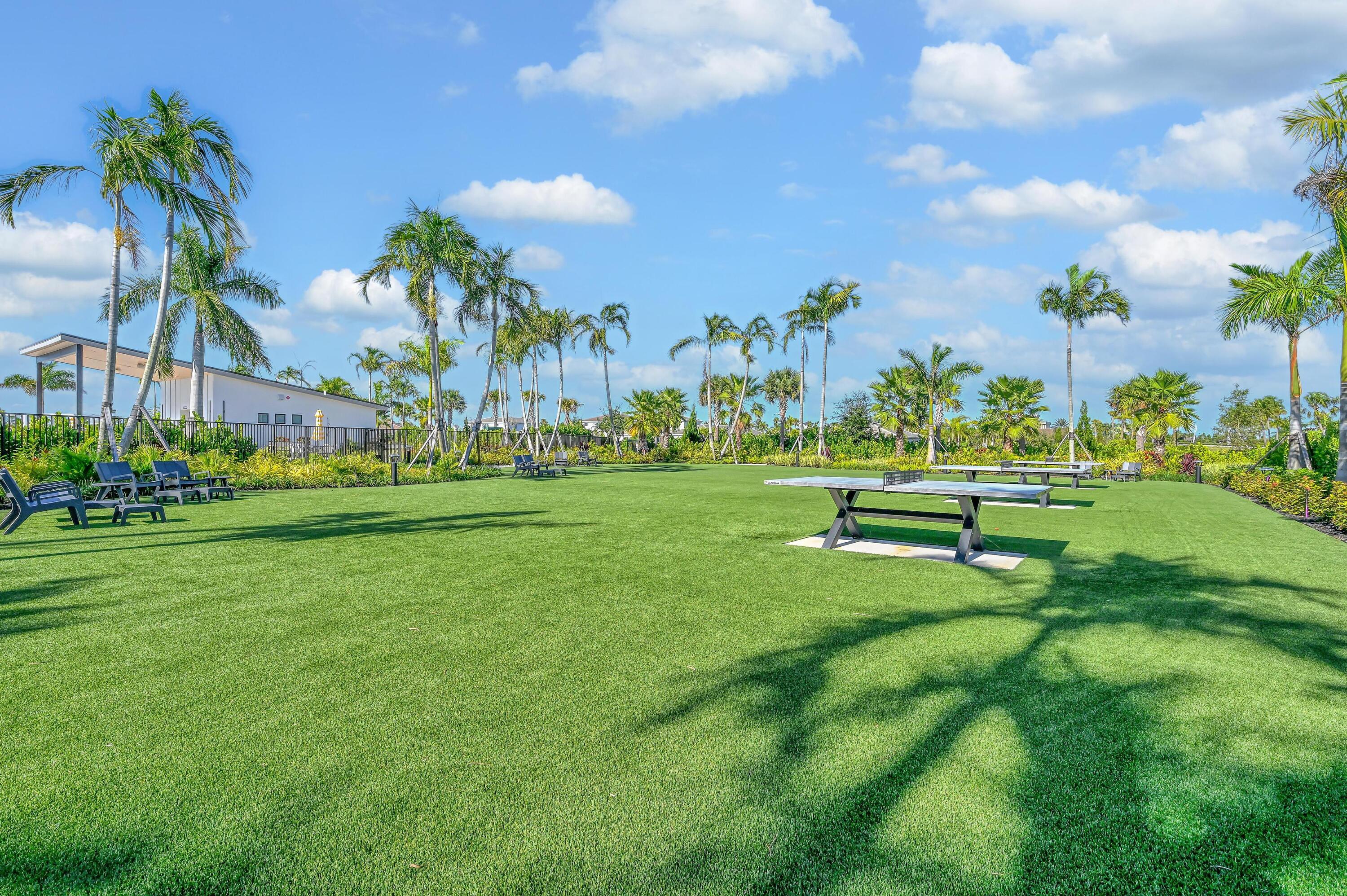14185 Southwest Daphne St Port Port St. Lucie, FL 34987 - Photo 41 of 46 a swimming pool with outdoor seating and yard