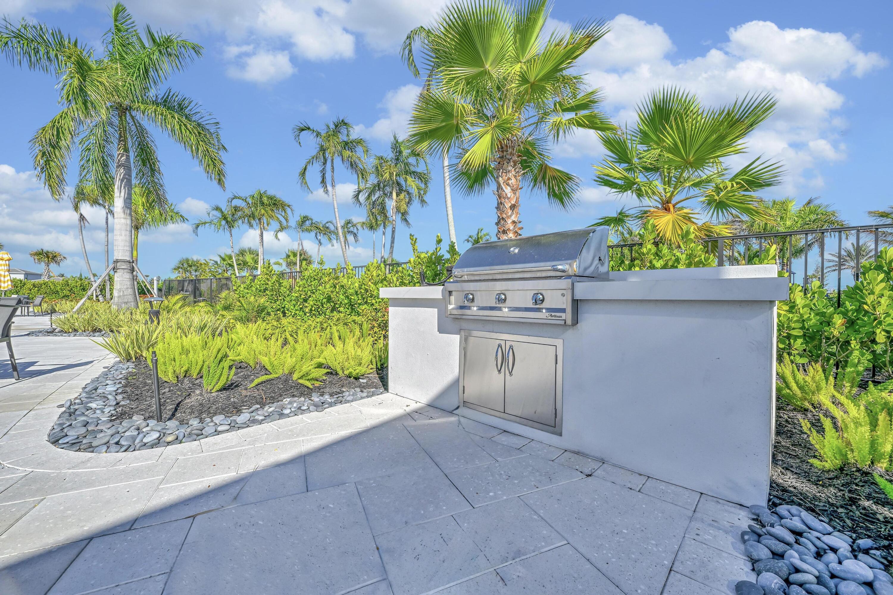 14185 Southwest Daphne St Port Port St. Lucie, FL 34987 - Photo 43 of 46 a view of a garden with a potted plant