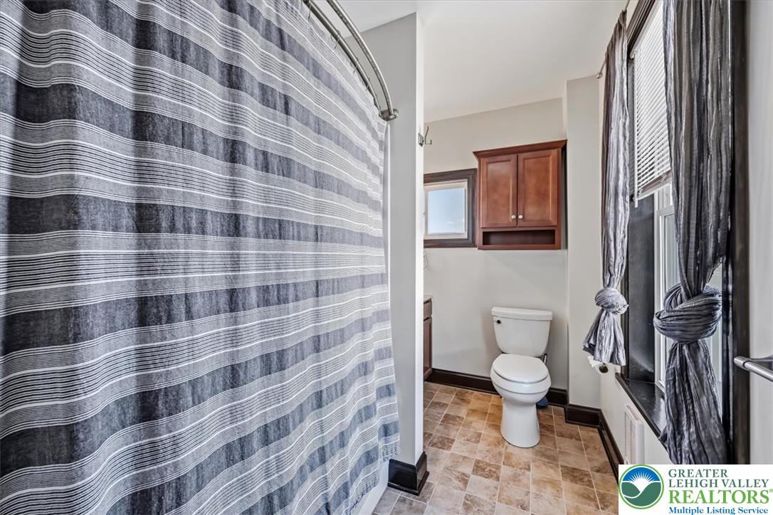 3453 Main Street Slatington, PA 18080 - Photo 15 of 30 A well-lit bathroom features patterned flooring and practical fixtures, creating a comfortable daily space.