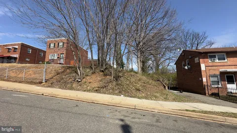 a view of a parking space in front of a house