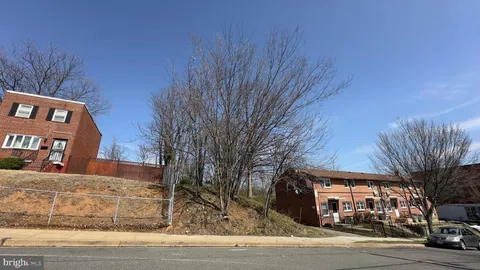 a front view of a building with tree s