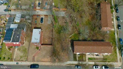 an aerial view of residential houses with outdoor space