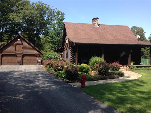 4 Woodlawn Road Freetown, MA 02702 - Photo 1 of 30 a front view of a house with a yard
