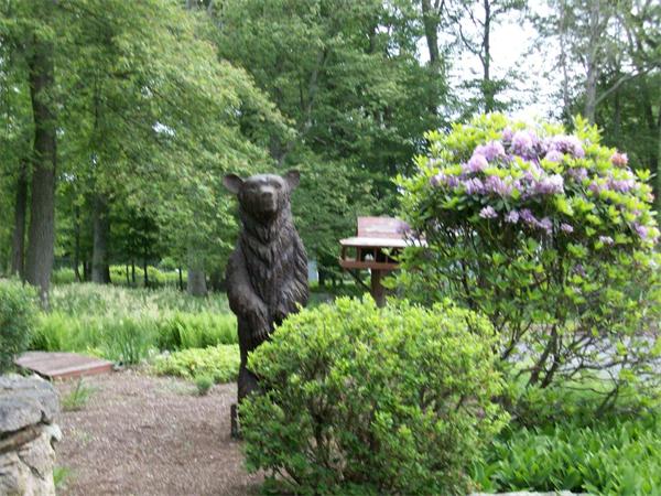 4 Woodlawn Road Freetown, MA 02702 - Photo 23 of 30 a backyard of a house with lots of green space and garden
